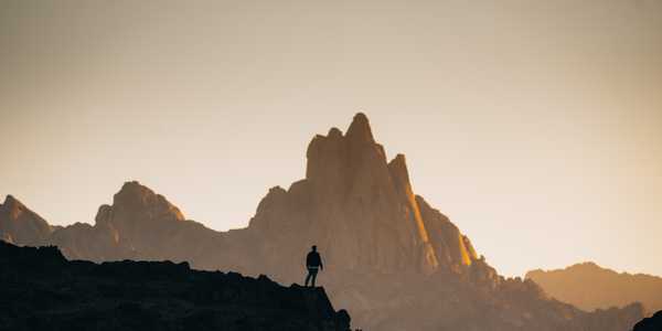 A man in the middle of mountains.